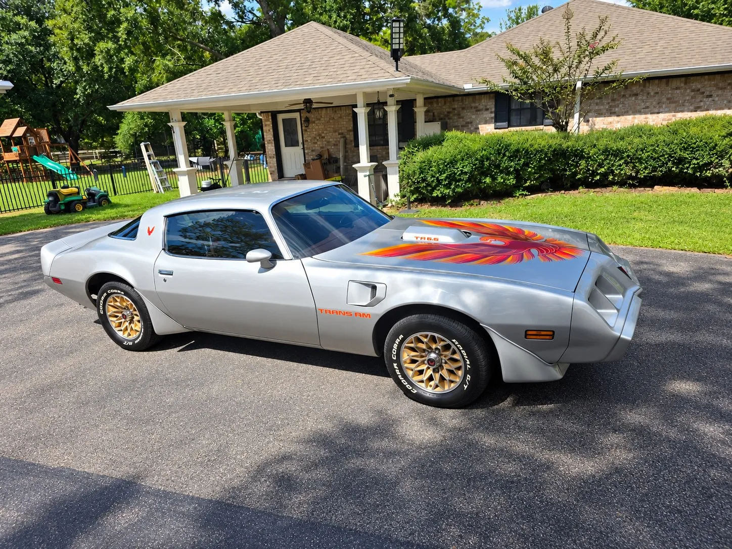 Silver Pontiac Trans Am outside Brix Auto in Tomball, TX